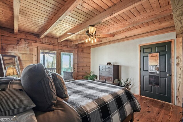 sunroom featuring beamed ceiling and wooden ceiling