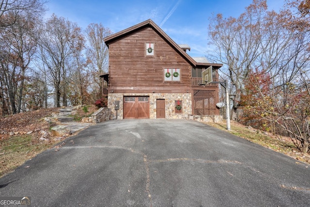 view of side of property featuring a garage