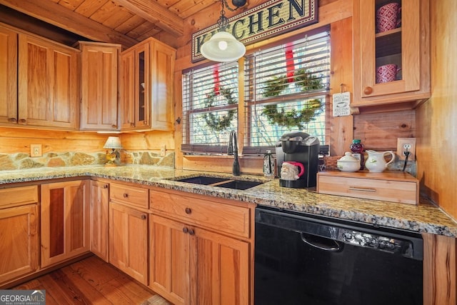 kitchen with light stone countertops, wood ceiling, beamed ceiling, dishwasher, and wood walls