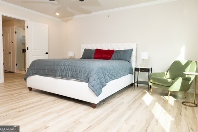 bedroom with light wood-type flooring, ceiling fan, and ornamental molding