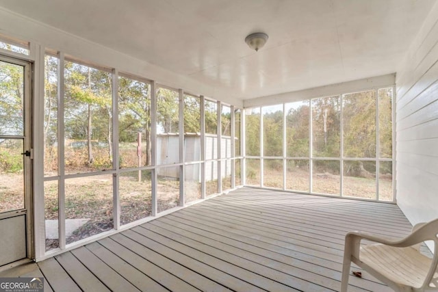 unfurnished sunroom featuring a wealth of natural light