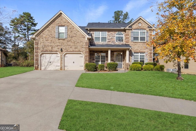 view of front facade with a garage and a front yard