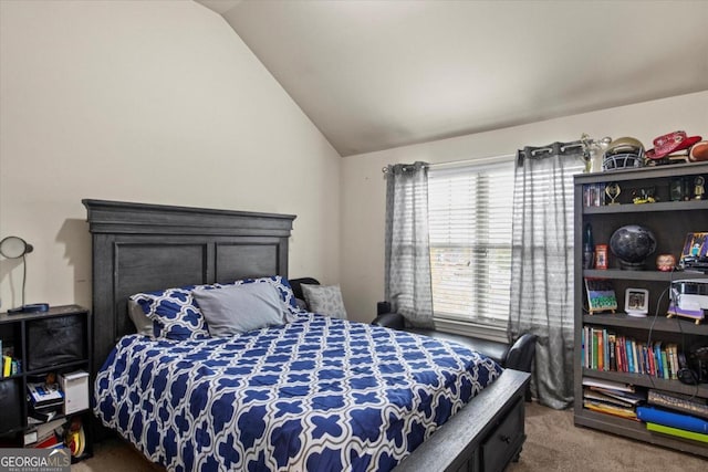 bedroom featuring carpet and lofted ceiling