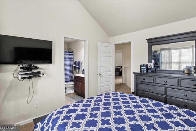 bedroom with carpet flooring, connected bathroom, and high vaulted ceiling