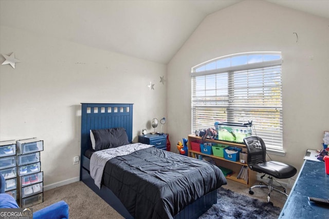 bedroom with dark carpet and lofted ceiling