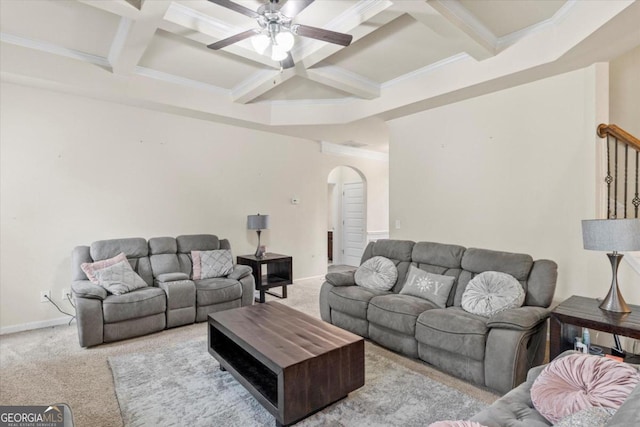 carpeted living room with beam ceiling, ceiling fan, coffered ceiling, and ornamental molding