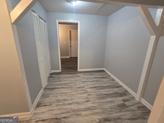 hallway featuring wood-type flooring