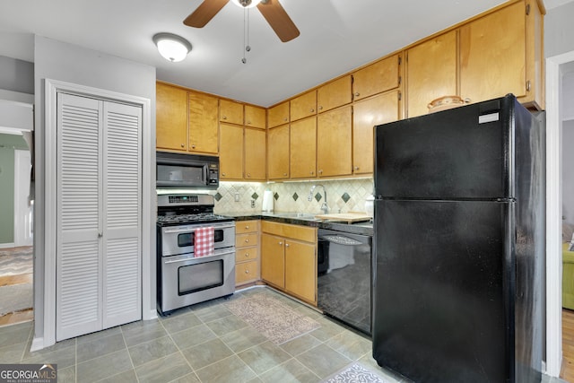 kitchen with black appliances, decorative backsplash, ceiling fan, and sink