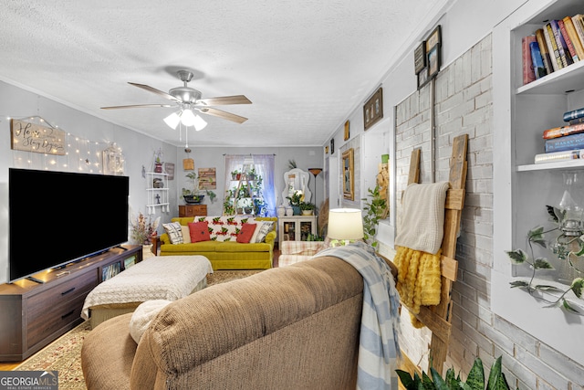 living room with ceiling fan, crown molding, and a textured ceiling