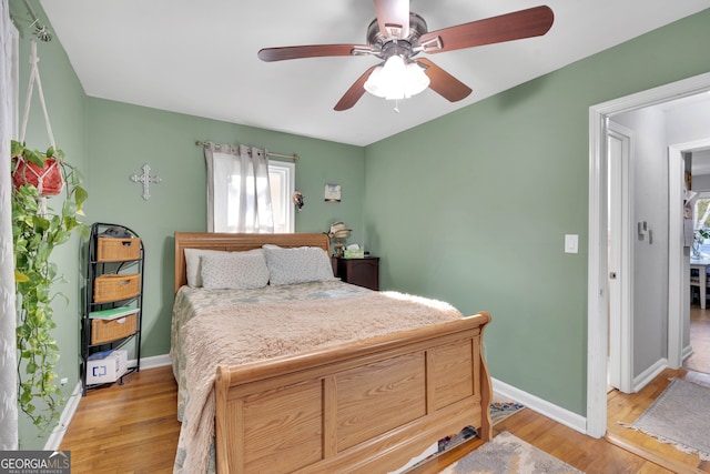 bedroom featuring ceiling fan and light hardwood / wood-style flooring