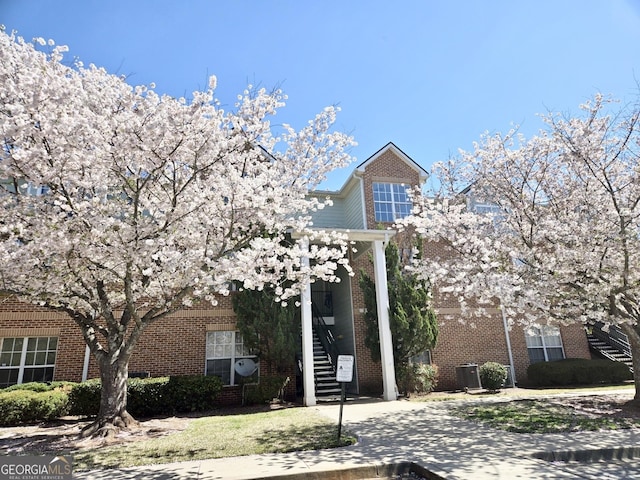 245 Amal Dr SW Unit 1008, Atlanta, GA 30315 - view of front of property with brick siding, cooling unit, and stairway