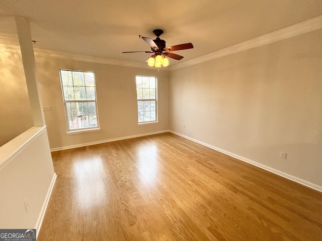 unfurnished room with crown molding, ceiling fan, and light hardwood / wood-style floors