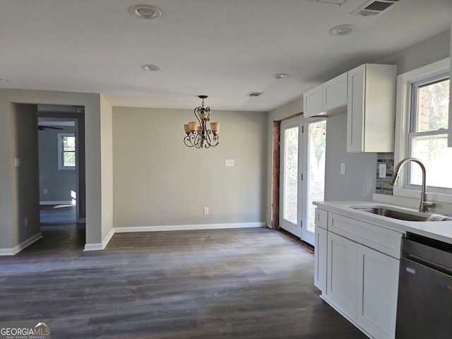 kitchen featuring white cabinets, stainless steel dishwasher, dark wood-type flooring, and sink