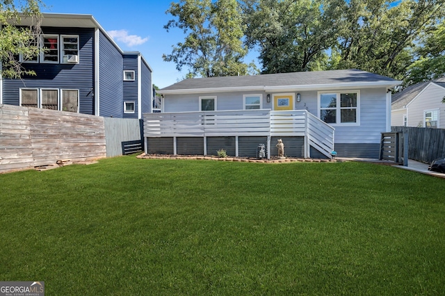 back of house featuring a yard