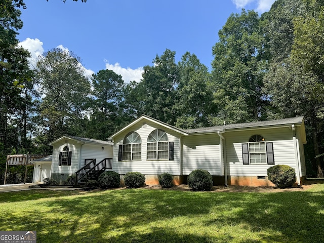 view of front facade with a front yard and a garage