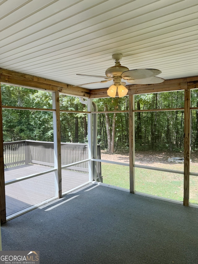 unfurnished sunroom with plenty of natural light and ceiling fan