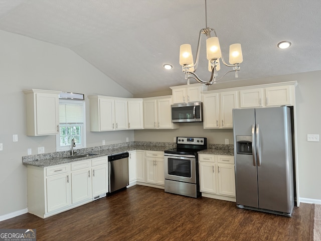 kitchen featuring lofted ceiling, dark wood-type flooring, sink, light stone counters, and stainless steel appliances