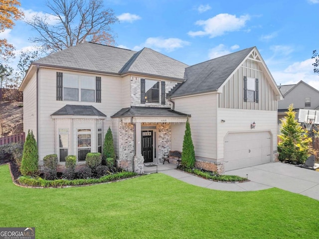 view of front of property featuring a front lawn and a garage