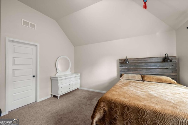 bedroom featuring carpet flooring and lofted ceiling