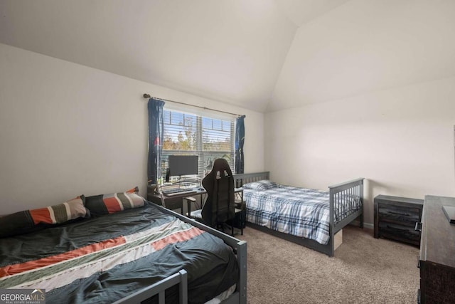 bedroom with carpet flooring and vaulted ceiling