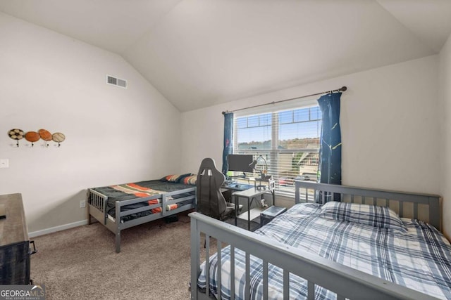 carpeted bedroom featuring vaulted ceiling