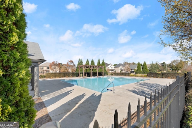 view of pool with a patio and a pergola