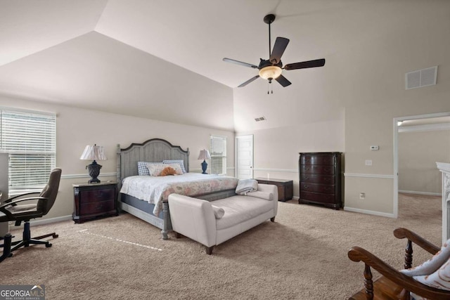 carpeted bedroom featuring ceiling fan and vaulted ceiling