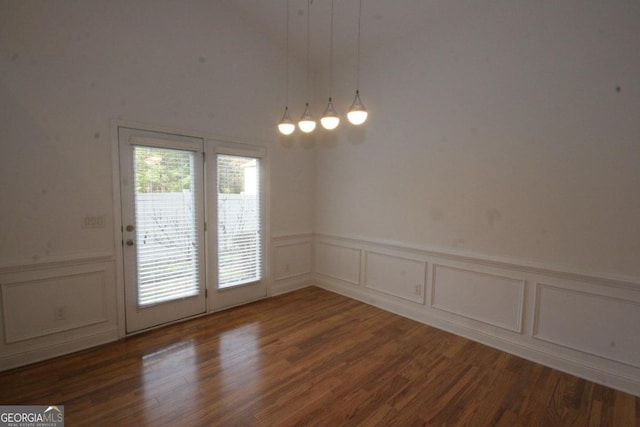 unfurnished room featuring dark wood-type flooring