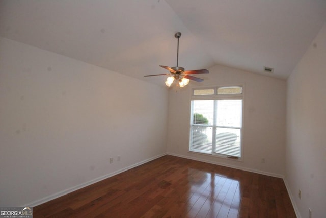 unfurnished room featuring dark hardwood / wood-style floors, ceiling fan, and lofted ceiling