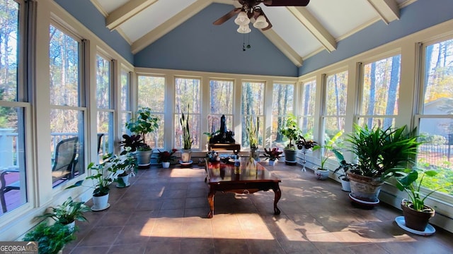 sunroom featuring vaulted ceiling with beams and ceiling fan