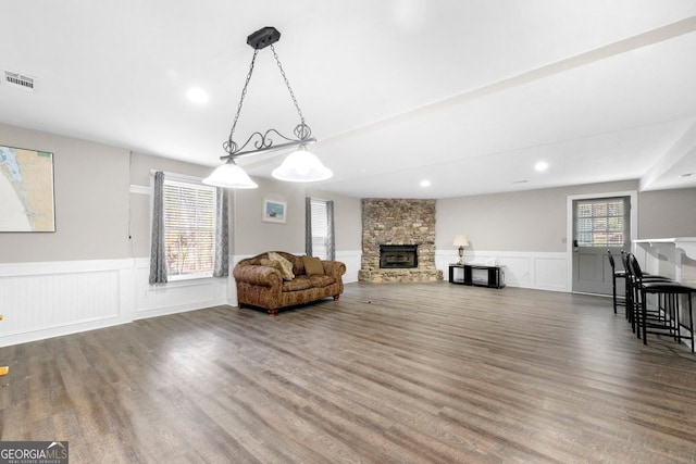 living room with a fireplace and hardwood / wood-style flooring