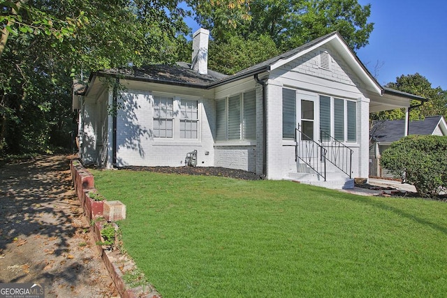 exterior space featuring a front lawn