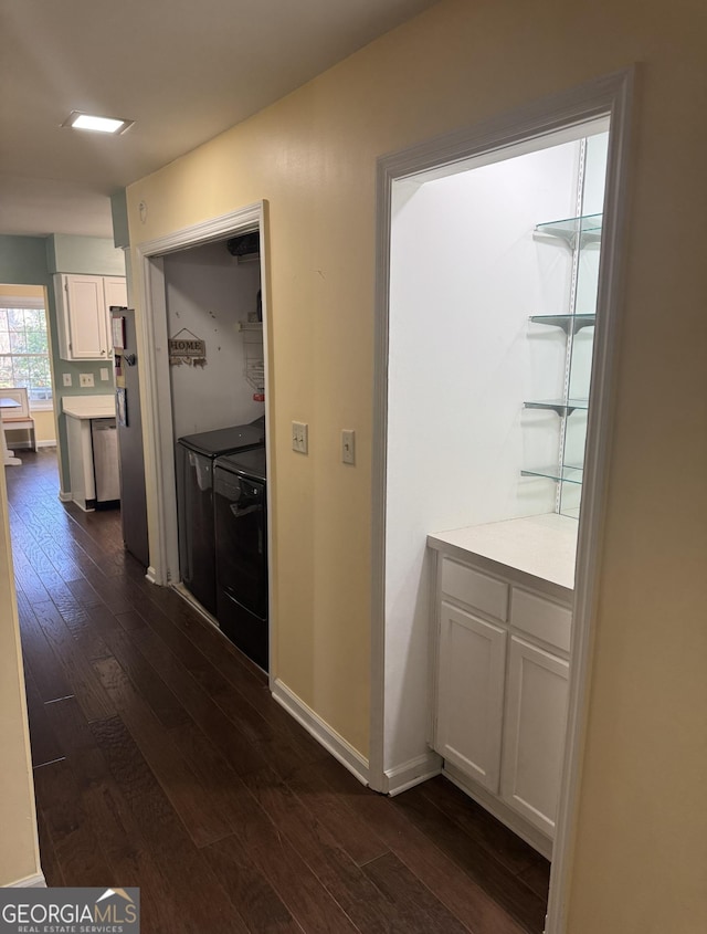 hallway with dark hardwood / wood-style floors