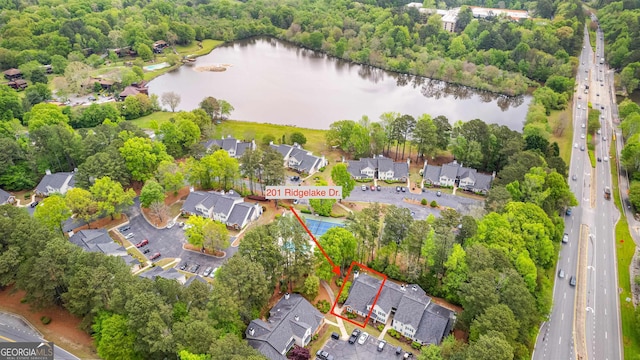 drone / aerial view with a water view