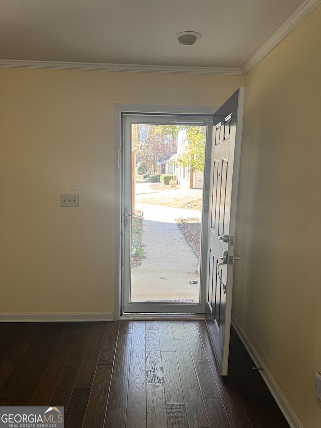 entryway with dark hardwood / wood-style flooring and crown molding