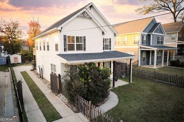 view of front of property with a lawn