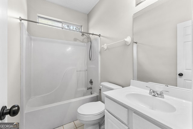 full bathroom featuring vanity, bathtub / shower combination, tile patterned flooring, toilet, and a textured ceiling