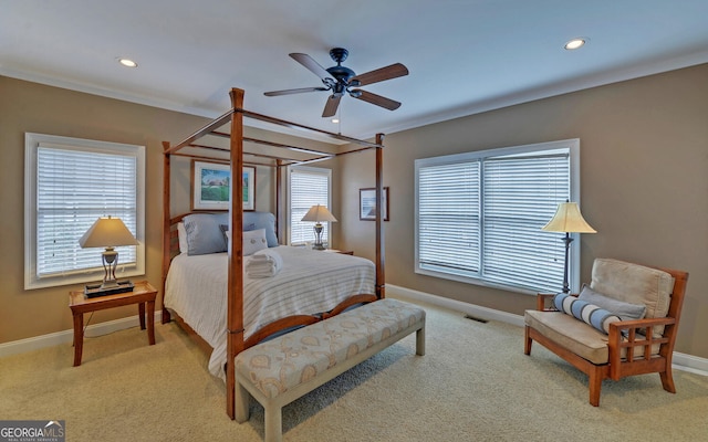 bedroom featuring ceiling fan, light colored carpet, and ornamental molding