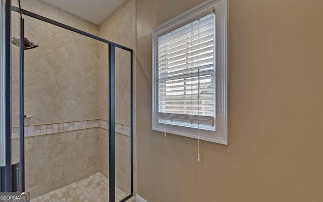 bathroom featuring an enclosed shower