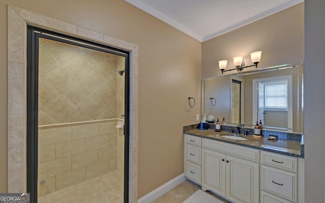 bathroom featuring tile patterned flooring, vanity, an enclosed shower, and ornamental molding