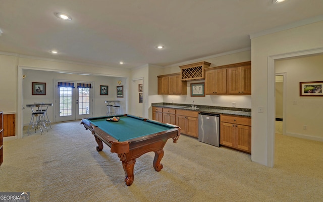 recreation room with sink, french doors, billiards, light colored carpet, and ornamental molding