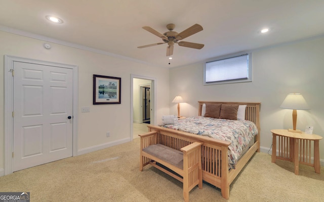 bedroom featuring ceiling fan, light colored carpet, and ornamental molding