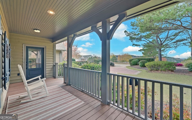 wooden deck featuring a porch