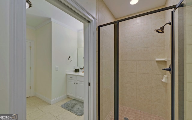 bathroom with vanity, tile patterned floors, an enclosed shower, and ornamental molding