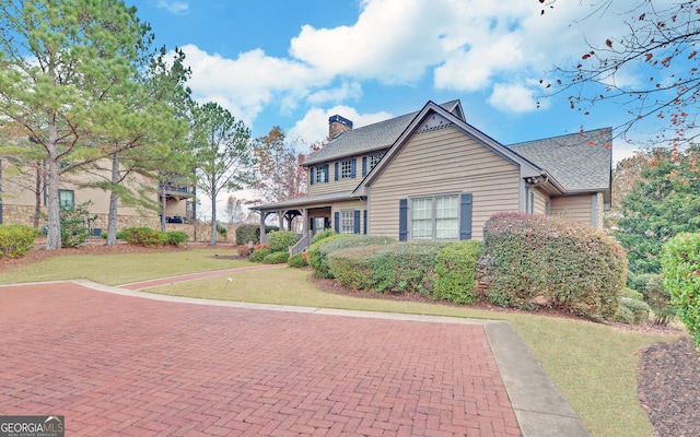 view of front of home with a front yard