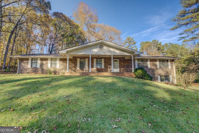 ranch-style home featuring a front yard