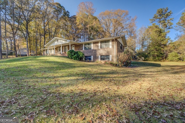 exterior space featuring a porch and a front yard