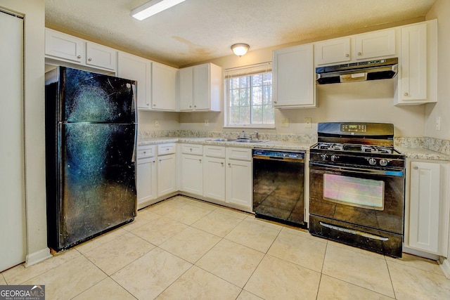 kitchen with black appliances, sink, white cabinets, and a textured ceiling