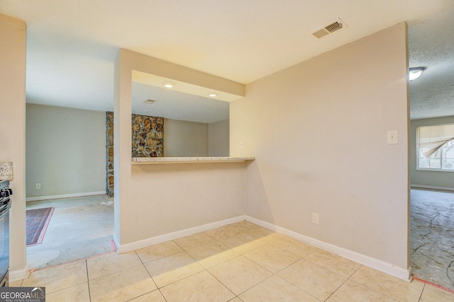 empty room with a textured ceiling