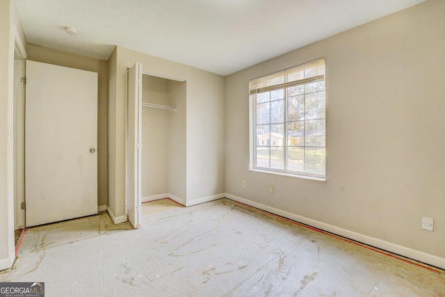 unfurnished bedroom with a closet